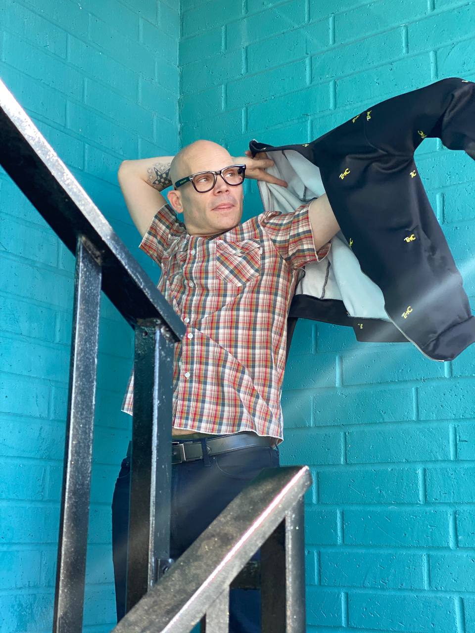 David Bonfadini standing on blue metal stairs